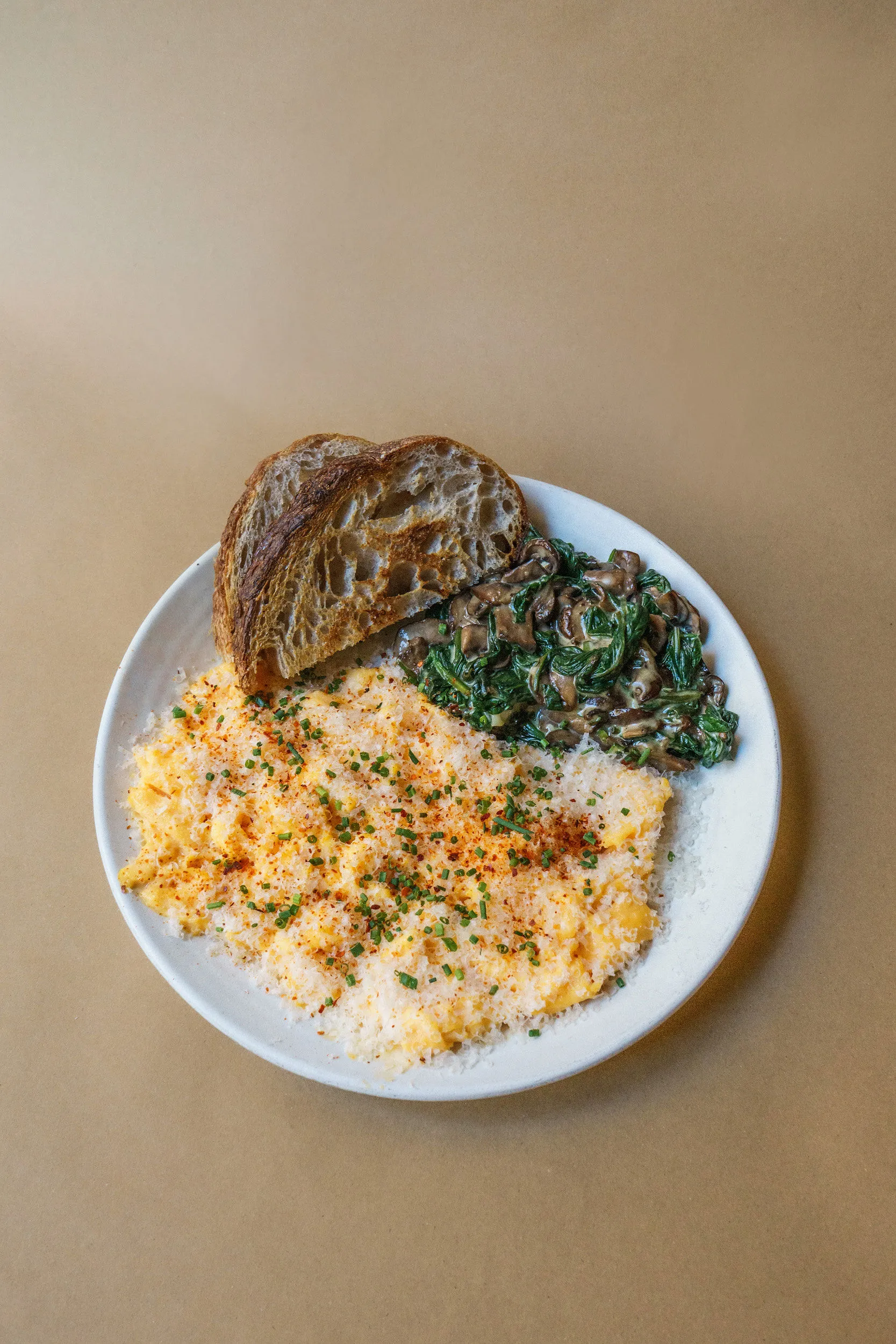 Mushroom scramble with creamed spinach and sourdough